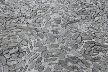 Old grey stone pavement  background texture close up