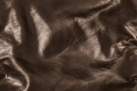 Dark brown leather texture slose up background