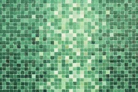 White and green mosaic wall background texture close upの写真素材