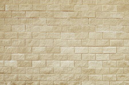 Old beige stone wall background texture close upの写真素材