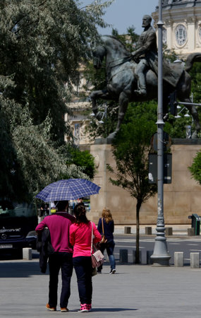 Bucharest, Romania - July 01, 2018: A couple walking on Victory Avenue in Bucharest, Romania.のeditorial素材