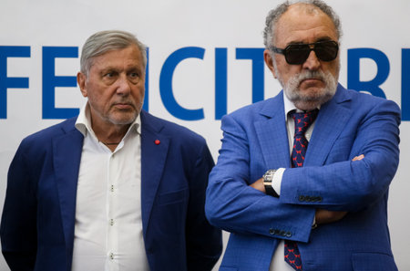 Bucharest, Romania - July 15, 2019: The former tennis glory Ilie Nastase and Ion Tiriac listen to the Wimbledon women's singles tennis champion Simona Halep speech at Henri Coanda Airport.のeditorial素材