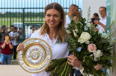 Bucharest, Romania - July 15, 2019: Wimbledon women's singles tennis champion Simona Halep poses with her replica of the Wimbledon trophy at her arrival ceremony at Henri Coanda Airport in Bucharestのeditorial素材