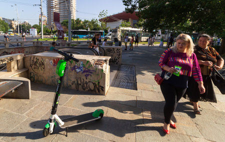 Bucharest, Romania - July 02, 2019: A Lime-S Electric Scooters is parked next to the University subway station entrance in Bucharest. This image is for editorial use only.のeditorial素材