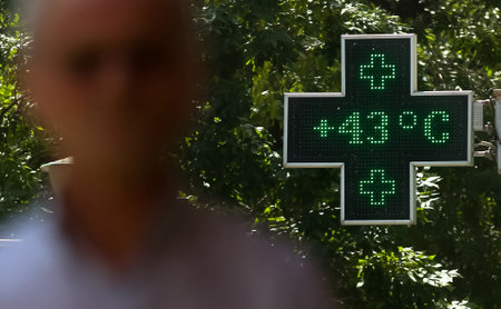 Bucharest, Romania - July 02, 2019: 43 degrees celsius (109.4 fahrenheit) is the temperature displayed by a digital thermometer on a hot summer outside a pharmacy. This image is for editorial use only.のeditorial素材