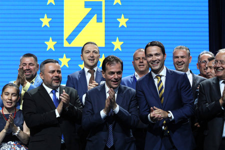 Bucharest, Romania - June 17, 2018: Ludovic Orban (C) enjoys together with Ioan Balan (L) and Robert Sighiartau (R) after was elected president of the National Liberal Party, in Bucharest.のeditorial素材