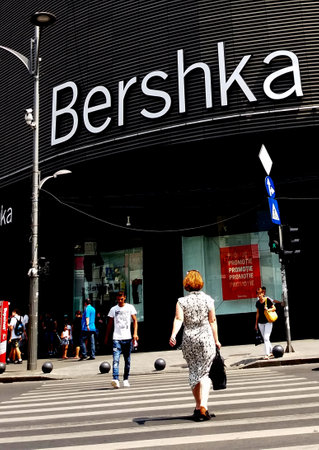 Bucharest, Romania - July 20, 2017: View with pedestrian crossing from the Bershka shop located in Unirea Shopping Center, in Unirii Square, Bucharest, Romania. July 20, 2017のeditorial素材