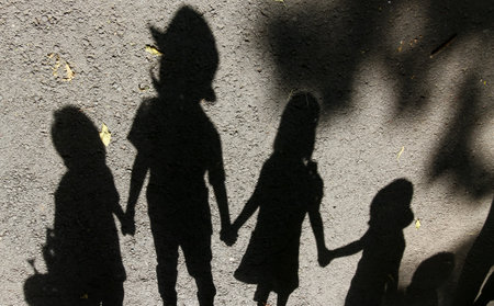 Bucharest, Romania - July 01, 2019: The shadow of a horo dance made by children is seen at the official opening of the summer kindergartens in Bucharest. This image is for editorial use only.のeditorial素材