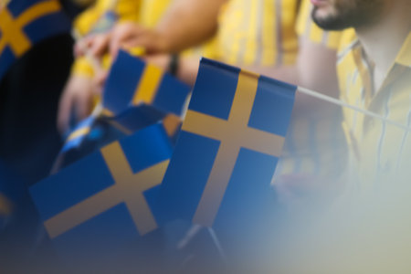 Bucharest, Romania - June 24, 2019: Blurry image of Sweden flags holding by IKEA staff are seen in the opening day of the IKEA Pallady store, which is the second in Bucharest and elsewhere in Romania.のeditorial素材