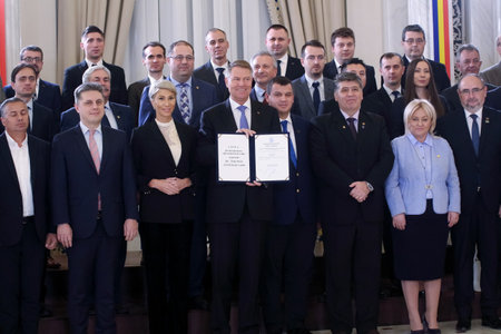 Bucharest, Romania - November 29, 2018: Klaus Iohannis, the president of Romania, poses with the leaders of the parties after signing of the law for the construction of highway Iasi - Targu Jiu.のeditorial素材