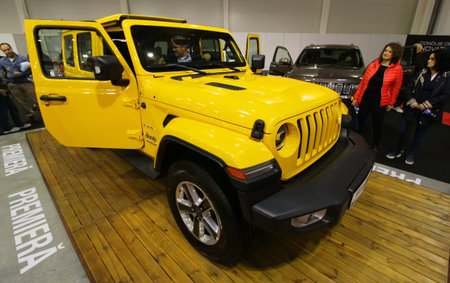 Bucharest, Romania - October 21, 2018: An yellow 2018 Wrangler JK Sahara car is exposed at the Bucharest Auto Show, in Bucharest, Romania. This image is for editorial use only.のeditorial素材