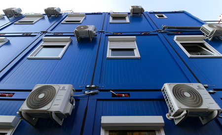 Bucharest, Romania - October 17, 2018: Several air conditioners are mounted on the wall of a building in Bucharest. This image is for editorial use only.のeditorial素材