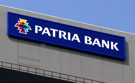 Bucharest, Romania -  October 17, 2018: A logo of Patria Bank, owned in majority by EEAF FINANCIAL SERVICES BV Amsterdam NLD, is displayed on the top of a building, in Bucharest, Romania.のeditorial素材