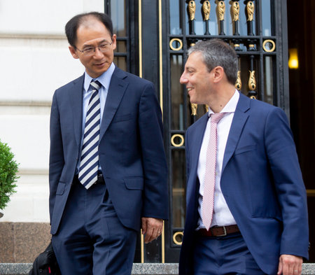 Bucharest, Romania - June 07, 2019: Jaewoo Lee, head of the International Monetary Fund mission for Romania and Bulgaria and Alejandro Hajdenberg, leave after a press conference held in Bucharest.のeditorial素材