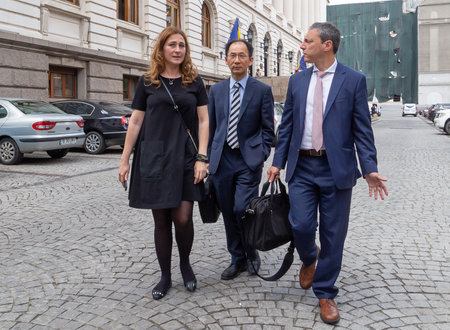Bucharest, Romania - June 07, 2019: Jaewoo Lee, head of the International Monetary Fund mission for Romania and Bulgaria and Alejandro Hajdenberg, leave after a press conference held in Bucharest.のeditorial素材