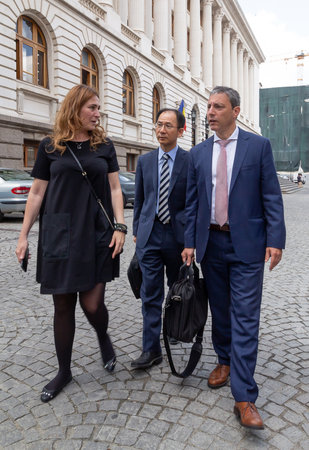 Bucharest, Romania - June 07, 2019: Jaewoo Lee, head of the International Monetary Fund mission for Romania and Bulgaria and Alejandro Hajdenberg, leave after a press conference held in Bucharest.のeditorial素材