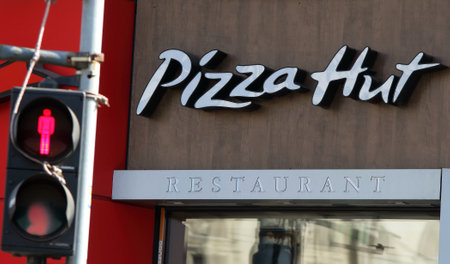 Bucharest, Romania - October 10, 2018: A logo of Pizza Hut restaurant chain is displayed on the front of a restaurant in downtown Bucharest, Romania.のeditorial素材