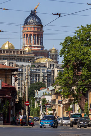 Bucharest, Romania - August 18, 2019: Romanian Peopleï¿½s Salvation Cathedral, building still under construction, can be seen in the background of buildings from street Mitropolitul Nifon, in Bucharest.のeditorial素材