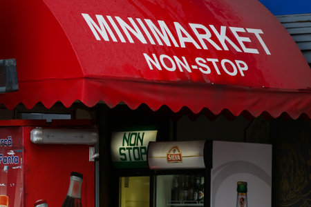Bucharest, Romania - November 15, 2018: A 24-hour minimarket store is seen on a street in downtown Bucharest. This image is for editorial use only.のeditorial素材