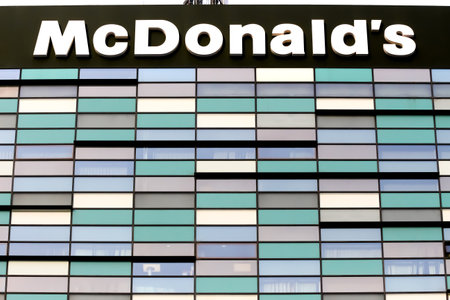 Bucharest, Romania - January 07, 2019: A logo of McDonald's fast food company is displayed on the top of a building, in Bucharest, Romania.のeditorial素材