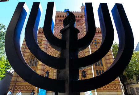 Bucharest, Romania - September 01, 2019: Menorah in front of The Coral Temple from Bucharest, raised between 1864-1866, the most impressive and beloved synagogue from Romania. Image for editorial use.のeditorial素材