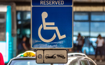 Bucharest, Romania - July 15, 2019: A Reserved Handicapped Parking Sign (Reserved Disabled Parking Sign) is seen in the parking of ââHenri Coanda Airport in Otopeni, 20 km. north of Bucharest.のeditorial素材
