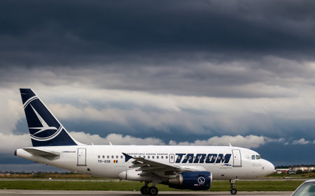 Bucharest, Romania - July 15, 2019: Tarom, YR-ASB, Airbus A318-100, MSN 2955, aircraft, named Traian Vuia, is seen while taxiing to runway before takeoff on Henri Coanda Airport in Otopeni.のeditorial素材