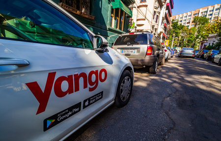 Bucharest, Romania - September 09, 2019: A car with the Yango logo of the multinational Yandex.Taxi BV belonging to Russian multinational corporation Yandex N.V. is parked on a street in Bucharest.のeditorial素材