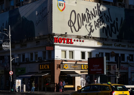 Bucharest, Romania -  December 22, 2019: A Five star hotel red logo is displayed on the facade of Bucharest Comfort Suites Hotel, in Bucharest, Romania.のeditorial素材
