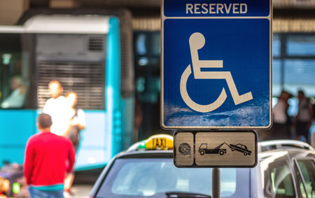 Bucharest, Romania - July 15, 2019: A Reserved Handicapped Parking Sign (Reserved Disabled Parking Sign) is seen in the parking of ââHenri Coanda Airport in Otopeni, 20 km. north of Bucharest.のeditorial素材