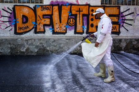 Bucharest, Romania - April 23, 2020: Sanitation employees clean the streets with environmentally active foam in an attempt to eliminate the spread of coronavirus.のeditorial素材