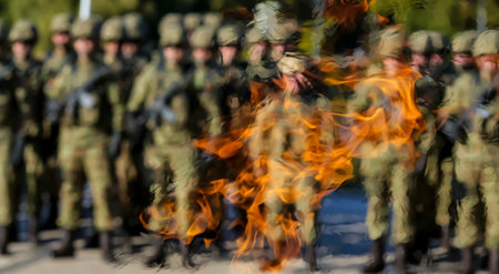 Bucharest, Romania - October 25, 2018: Background image of the elite troops of the Romanian army blurred by heat of the eternal flame that burns at the grave of the unknown soldier, in Carol Park.のeditorial素材