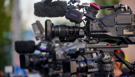 A big Sony CineAlta XDCAM HD shoulder camcorder of a news TV channel is seen at a news event in Bucharest.のeditorial素材