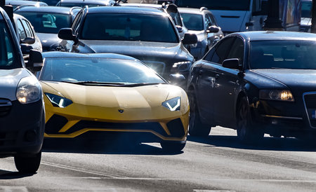 Bucharest, Romania - February 04, 2021 An yellow Lamborghini Aventador S Roadster is seen in traffic, in Bucharet. This image is for editorial use only.のeditorial素材