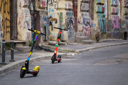 Bucharest, Romania - May 27, 2021: Splash and Lime (rent on Uber) electric scooters are parked on a sidewalk in Bucharest. This image is for editorial use only.のeditorial素材