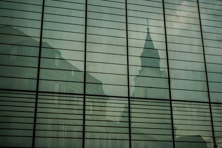Bucharest, Romania - June 18, 2021: The Roman Catholic church "Baratia", is seen in the reflection of the windows of Cocor Store in downtown Bucharest.のeditorial素材