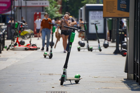 Bucharest, Romania - July 25, 2019: Several Lime-S electric scooters are parked on a sidewalk in Bucharest. This image is for editorial use only.のeditorial素材