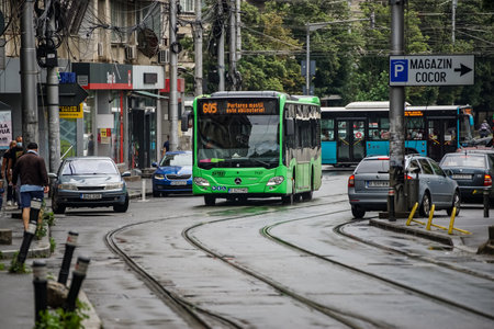Bucharest, Romania - June 18, 2021: A public transport bus Mercedes Citaro Hybrid is driven in traffic on a boulevard in Bucharest.This image is for editorial use only.のeditorial素材