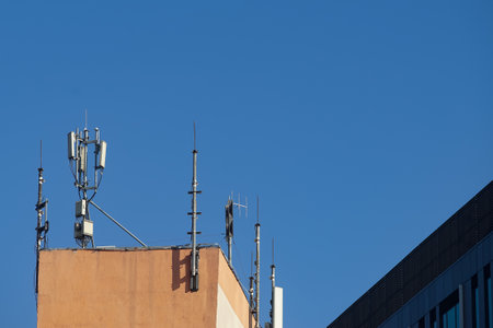Bucharest, Romania - October 04, 2021: Many GSM telecommunications antennas are installed on a building in Bucharest. This image is for editorial use only.のeditorial素材