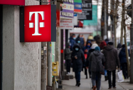 Bucharest, Romania -  February 16, 2021: A logo of Telekom, German telecommunications company, is displayed on top of a store, in Bucharest, Romania.のeditorial素材