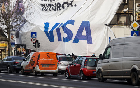Bucharest, Romania - January 03, 2022: A big VISA advertisement on a huge banner is being lifted on a building in Bucharest.のeditorial素材
