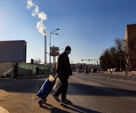 Bucharest, Romania - January 14, 2022: Chimney of CET Progresul power plant, pollute with smoke from the burning of heating oil and gases, in the south of Bucharest.のeditorial素材