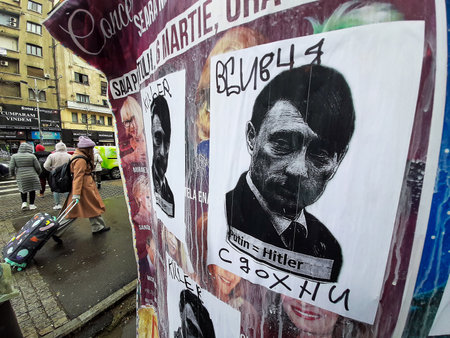 Bucharest, Romania - March 01, 2022: Protest poster against Vladimir Putin depicted as Hitler, and against his insane war attack against Ukraine.のeditorial素材