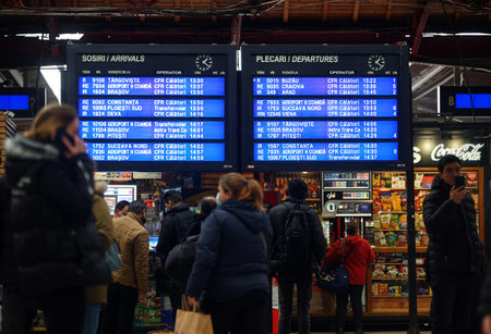 Bucharest, Romania - March 04, 2022: The arrival departure board from the central platform of the Northern Railway Station.のeditorial素材
