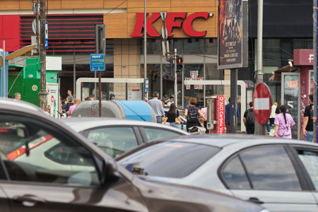 Bucharest, Romania - July 07, 2022: A logo of a KFC fast food restaurant from the ground floor of Unirea shopping Center in downtown Bucharest.のeditorial素材