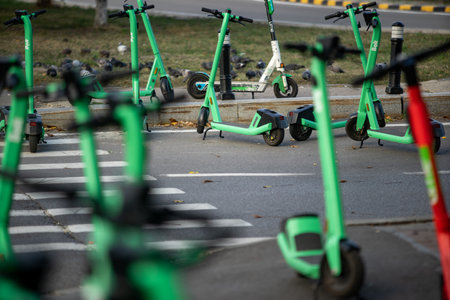 Bucharest, Romania - October 07, 2022: Bolt electric scooters are wrongly parked blocking access on the sidewalk in Bucharest. This image is for editorial use only.のeditorial素材