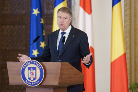 Bucharest, Romania - December 12, 2022: Romanian President Klaus Iohannis and Switzerland President Ignazio Cassis (not in picture) hold a press conference at the Cotroceni Palace.のeditorial素材