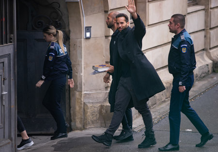 Bucharest, Romania - January 10, 2023: Andrew Tate and his brother Tristan arrived in handcuffs at the Bucharest Court of Appeal for their appeal against the 30-day arrest for human trafficking.のeditorial素材
