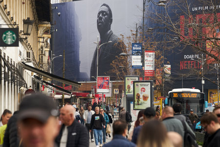 Bucharest, Romania - March 21, 2023: Extra large banner advertising Luther: The Fallen Sun movie is displayed on a large building, in downtown Bucharest. This image is for editorial use only.のeditorial素材