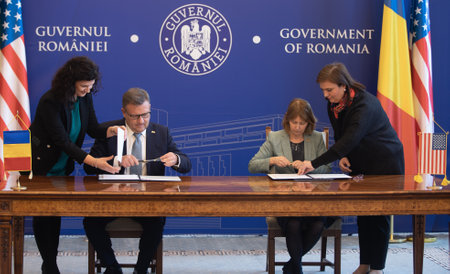 Bucharest, Romania. 23th Mar, 2023: Kathleen Kavalec, US ambassador to Romania, and Marius Budai, Romanian Minister of Labor, at the signing of the Social Security Agreement between USA and Romania.のeditorial素材